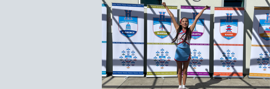 Cheerleader in front of House banners